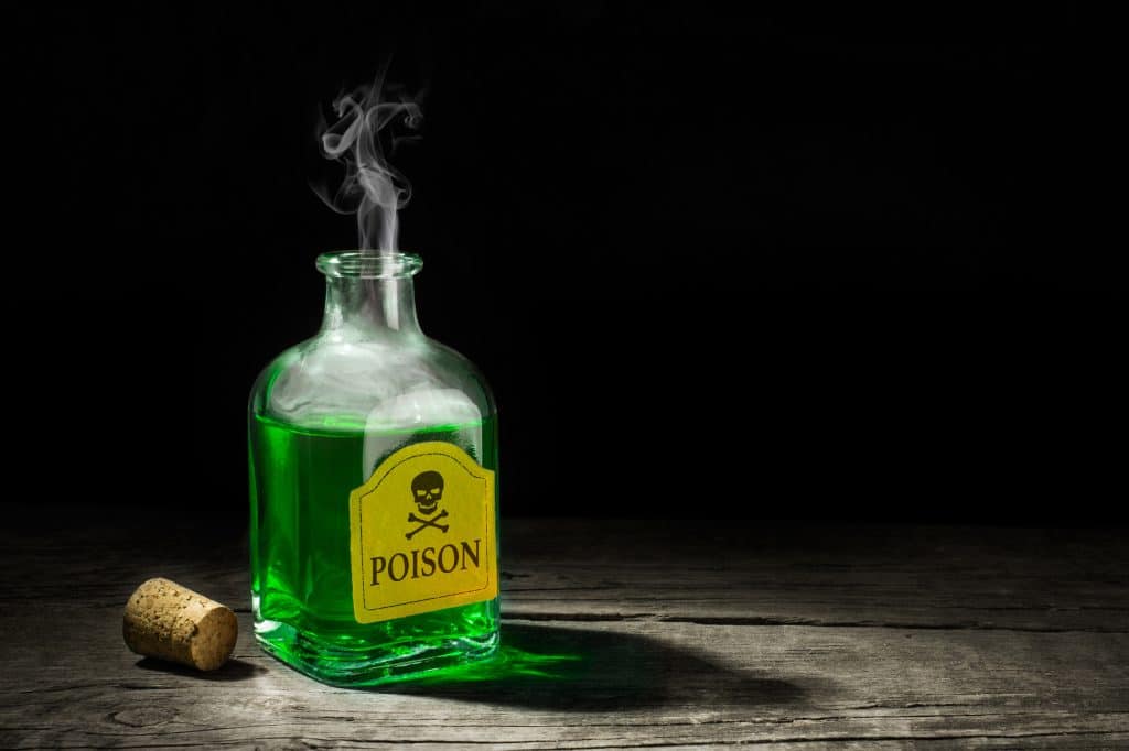 Green poison bottle with the cork off and fumes coming out the top