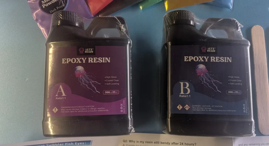 Let’s Resin Part A and Part B epoxy bottles side by side, showing the WARNING label on Part A and the DANGER label on Part B
