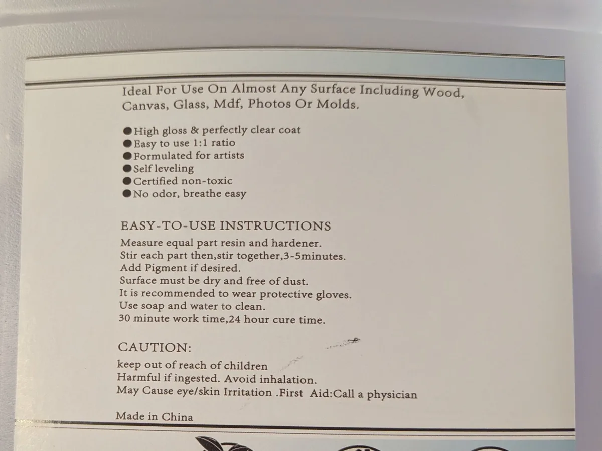 Back label of Bilnins epoxy resin listing Certified non-toxic and No odor alongside Harmful if ingested and Avoid inhalation